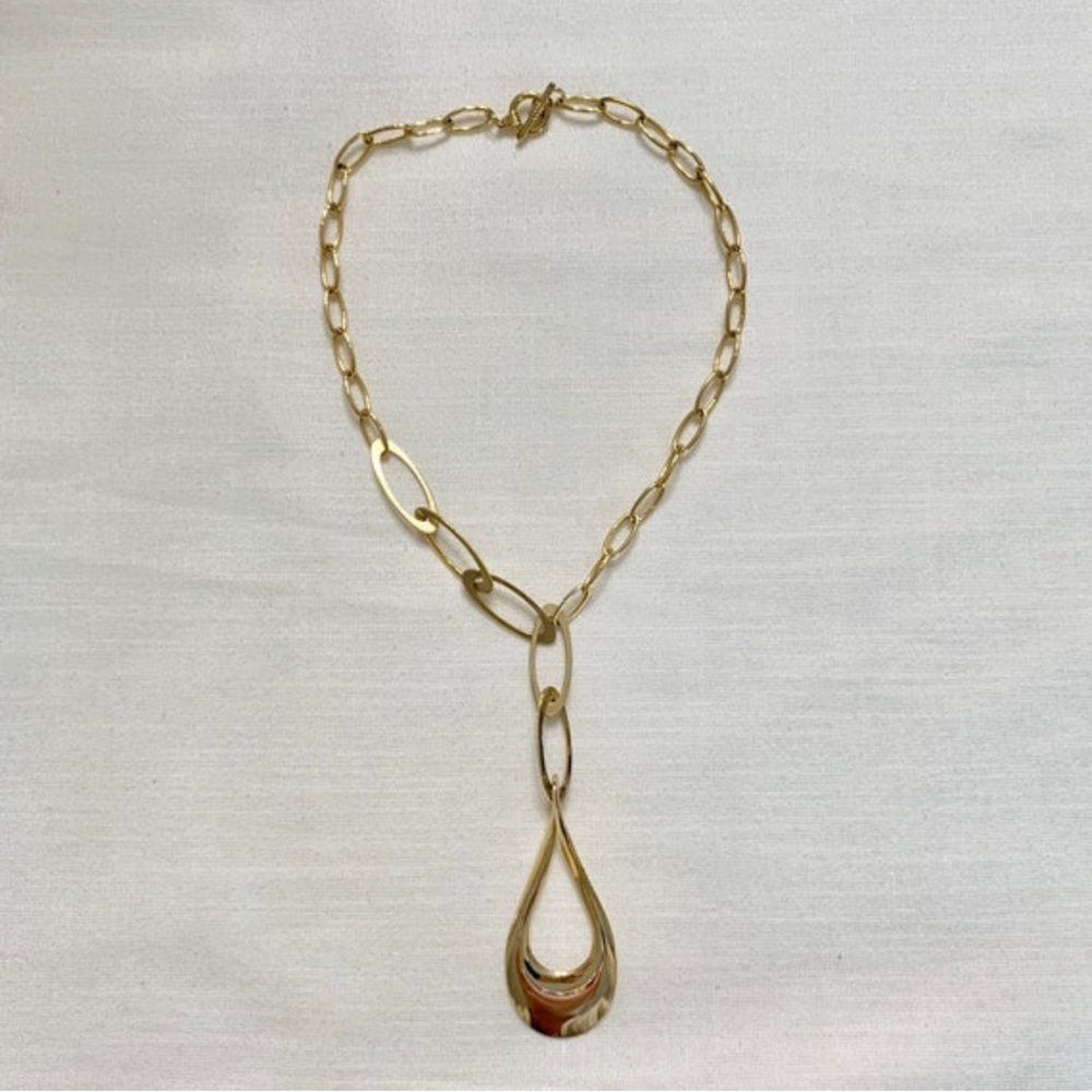 Vintage large dangling gold pendant necklace.